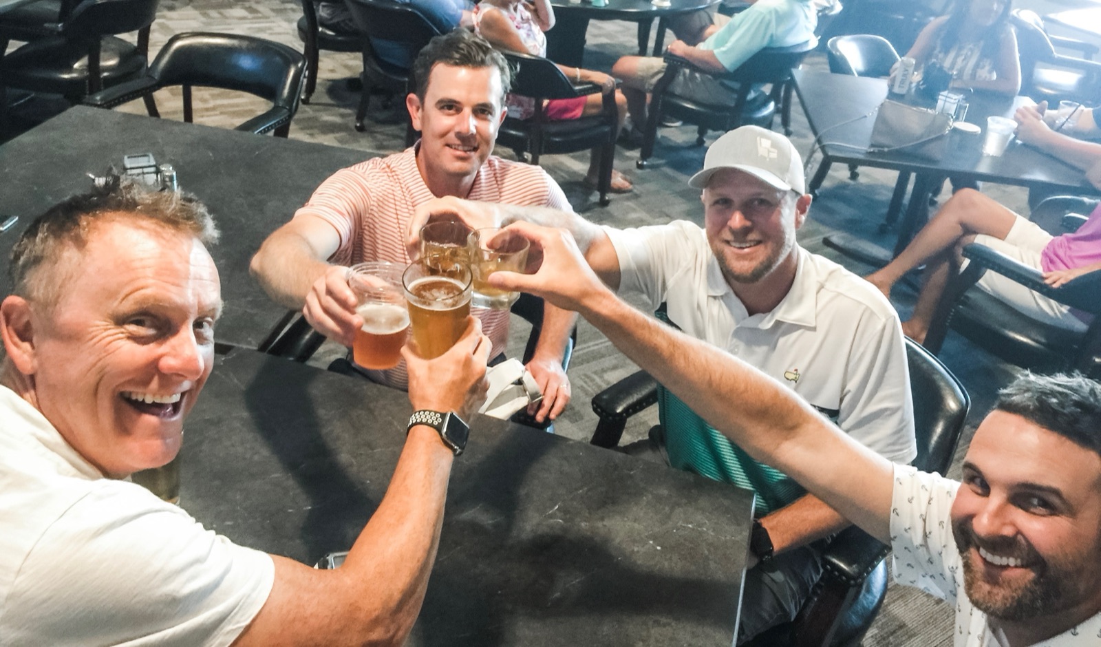 Spark golfers toasting after a round